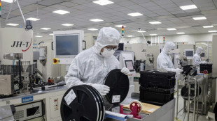 US slams China policies on chips but will delay tariffs to 2027